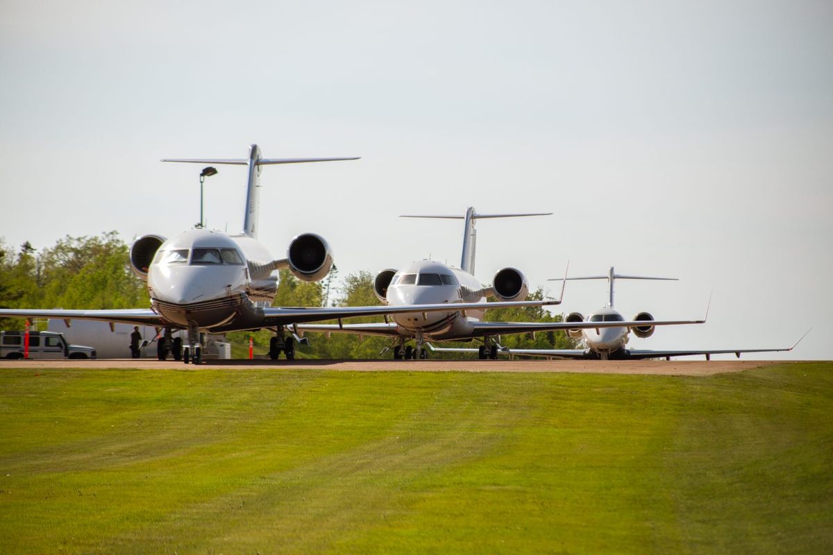 Three private jets parked on the apron at Fox Harb'r's jetport